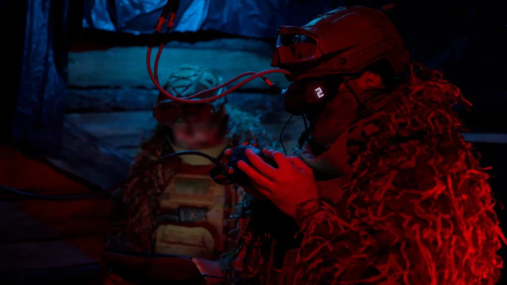 Servicemen in FPV glasses and with a stick